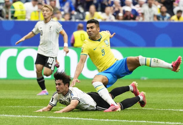 Football: 2026 World Cup Japan s Kaishu Sano (bottom) scores the opening goal in the first half of a World Cup round of 32 football match against Brazil at Houston Stadium in Houston on June 29, 2026.  A14AA0005620715P
