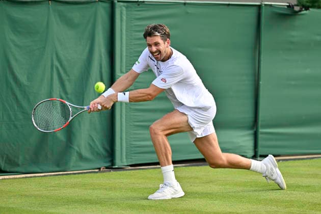 RECORD DATE NOT STATED 29th June 2026; All England Lawn Tennis and Croquet Club, London, England; Wimbledon Tennis Tournament, Day One; Cameron Norrie (GBR) plays a backhand in his first round match against Michael Zheng (USA) GodfreyxPitt