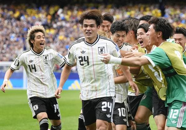 Football: 2026 World Cup Japan s Kaishu Sano (24) celebrates with teammates after scoring the opening goal in the first half of a World Cup round of 32 football match against Brazil at Houston Stadium in Houston on June 29, 2026.  A14AA0005620720P