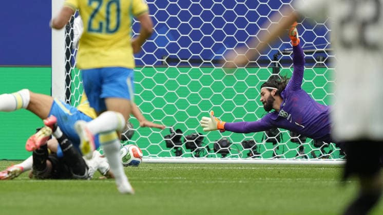 Football: 2026 World Cup Brazil goalkeeper Alisson (back, R) concedes a goal in the first half of a World Cup round of 32 football match against Japan at Houston Stadium in Houston on June 29, 2026.  A14AA0005620727P