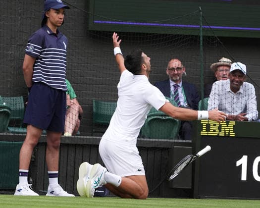 ennis - 2026 Wimbledon Championships - Day One (Week One) - All England Lawn Tennis & Croquet Club, London - Monday 29th June 2026 Men™s Singles, First Round: Yibing Wu (CHN) vs.Novak Djokovic (SER) Novak Djokovic jokingly falls to the ground after a missed shot COLORSPORT ANDREW COWIE 