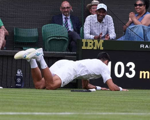 ennis - 2026 Wimbledon Championships - Day One (Week One) - All England Lawn Tennis & Croquet Club, London - Monday 29th June 2026 Men™s Singles, First Round: Yibing Wu (CHN) vs.Novak Djokovic (SER) Novak Djokovic jokingly falls to the ground after a missed shot COLORSPORT ANDREW COWIE 