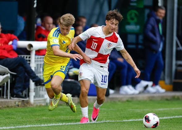 Bangor, Wales, 29th June 2026. Yurii Kokodyniak of Ukraine and Patrice Covic of Croatia battle for the ball during the Croatia U19 vs Ukraine U19 UEFA European U19 Championship match at Bangor City Stadium, Bangor. Picture credit should read: Cody Froggatt Sportimage EDITORIAL USE ONLY. No use with unauthorised audio, video, data, fixture lists, club league logos or live services. Online in-match use limited to 120 images, no video emulation. No use in betting, games or single club league player publications. SPI_007_CF_CROATIA_U19_V_UKRAINE_U19 SPI-4855-0006