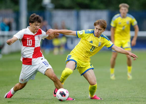 Bangor, Wales, 29th June 2026. Patrice Covic of Croatia and Patryk Sykut of Ukraine battle for the ball during the Croatia U19 vs Ukraine U19 UEFA European U19 Championship match at Bangor City Stadium, Bangor. Picture credit should read: Cody Froggatt Sportimage EDITORIAL USE ONLY. No use with unauthorised audio, video, data, fixture lists, club league logos or live services. Online in-match use limited to 120 images, no video emulation. No use in betting, games or single club league player publications. SPI_014_CF_CROATIA_U19_V_UKRAINE_U19 SPI-4855-0014