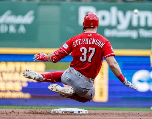 Cincinnati Reds catcher Tyler Stephenson slides into second base after hitting a double in the second inning of the MLB, Baseball Herren, USA game between the Cincinnati Reds and the Milwaukee Brewers at American Family Field in Milwaukee, Wisconsin on Monday, June 29, 2026.  MIL20260629808 TANNENxMAURY