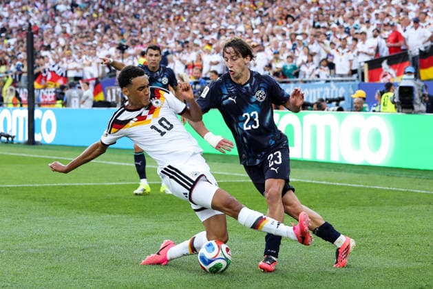 FOXBOROUGH, MASSACHUSETTS - JUNE 29: Jamal Musiala of Germany tackles Matias Galarza of Paraguay during the FIFA World Cup, WM, Weltmeisterschaft, Fussball 2026 Round of 32 match between Germany and Paraguay at Boston Stadium on June 29, 2026 in Foxborough, Massachusetts.  Copyright: xWuxZhizhaox 111651327733