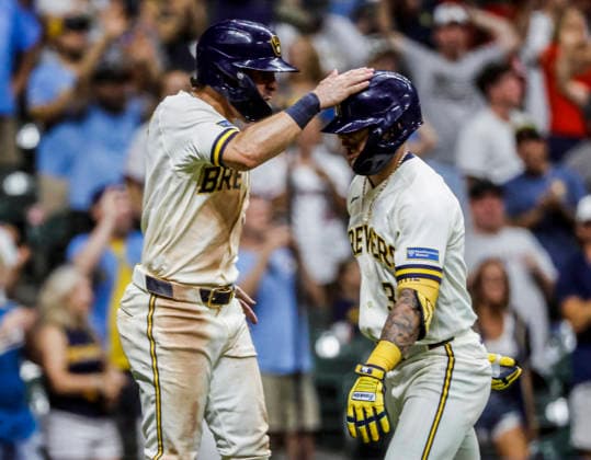 Milwaukee Brewers third baseman Joey Ortiz (R) celebrates with Milwaukee Brewers right fielder Sal Frelick after hitting a two RBI home run in the eighth inning of the MLB, Baseball Herren, USA game between the Cincinnati Reds and the Milwaukee Brewers at American Family Field in Milwaukee, Wisconsin on Monday, June 29, 2026.  MIL20260629848 TANNENxMAURY