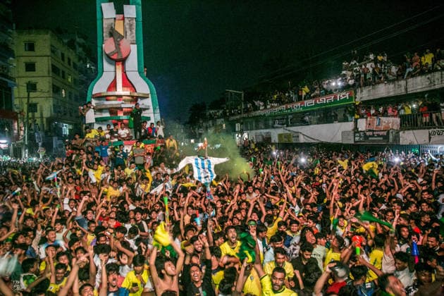 June 30, 2026, Munshiganj, Bangladesh: Thousands of Brazilian football supporters flood the Supermarket Chottor, as Brazil secured a 2-1 victory over Japan in the FIFA World Cup, WM, Weltmeisterschaft, Fussball 2026 group stage. Despite heavy rain, the crowd - draped in yellow jerseys and waving green-and-gold flags - packed every inch of the square, climbing monument structures and rooftops to catch a glimpse of the giant screen. Dhaka Bangladesh - ZUMAa259 0860352491st Copyright: xRayhanxAhmedx