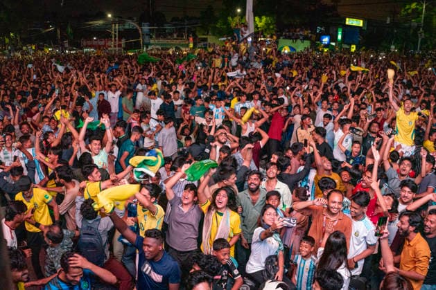 Bangladesh: Football Fans In Chattogram Watch FIFA World Cup, WM, Weltmeisterschaft, Fussball 2026 Match Brazil Vs Japan Fans in jerseys cheer, wave hands, and jump together during a nighttime screening in Chattogram, Bangladesh, on June 30, 2026. Thousands of football fans gather at Kazir Dewri and 2 No. Gate intersections at midnight to watch the live telecast of the FIFA World Cup match between Brazil and Japan on giant screens. The gathering of Brazil supporters creates a vibrant street festival atmosphere as they cheer for their team. Chattogram Bangladesh  Copyright: xZakirxHossainx originalFilename:hossain-notitle260630_npPtY.jpg