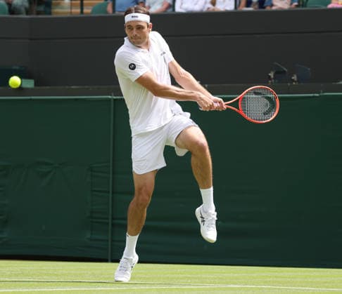 USA s Taylor Fritz plays a backhand in his match against Serbian Dusan Lajovic on day two of the 2026 Wimbledon Championships in London on Tuesday, June 30, 2026.  LON2026063025 HUGOxPHILPOTT