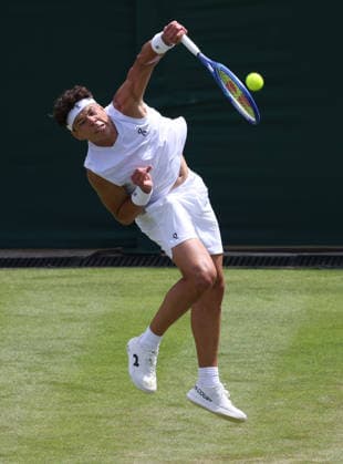American Ben Shelton serves in his match against Finland s Otto Virtanen on day two of the 2026 Wimbledon Championships in London on Tuesday, June 30, 2026.  LON2026063039 HUGOxPHILPOTT