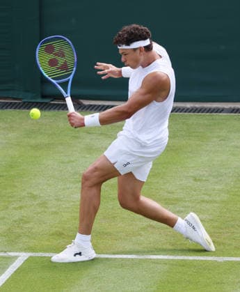 American Ben Shelton plays a backhand in his match against Finland s Otto Virtanen on day two of the 2026 Wimbledon Championships in London on Tuesday, June 30, 2026.  LON2026063045 HUGOxPHILPOTT