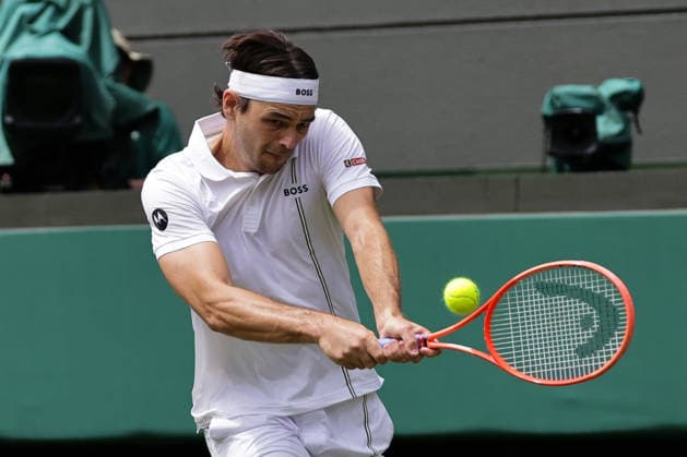 (260630) -- LONDON, June 30, 2026 -- Taylor Fritz of the United States returns the ball during the men s singles first round match against Dusan Lajovic of Serbia at Wimbledon tennis Championship in London, Britain, on June 30, 2026. (Photo by Xinhua) (SP)BRITAIN-LONDON-TENNIS-WIMBLEDON-MEN S SINGLES DinendraxHaria 