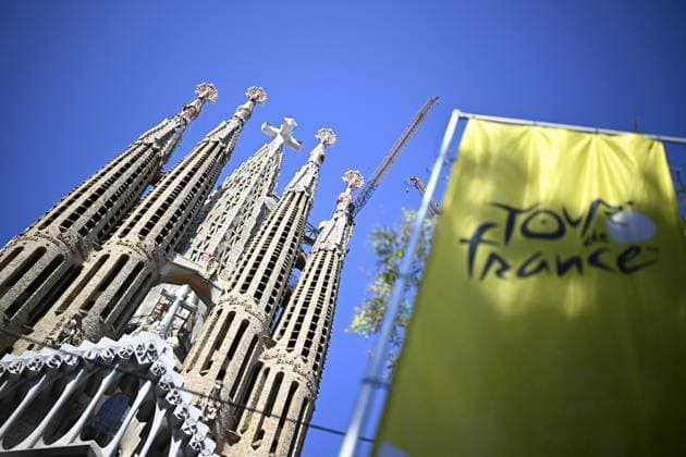 Sagrada Familia and a flaf of TDF pictured ahead of the 2026 Tour de France cycling race, Tuesday 30 June 2026, in Barcelona, Spain. The 113th edition of the Tour de France starts on Saturday 4 July in Barcelona, Spain, and will finish in Paris, France on the 26th of July. JASPERxJACOBS  x180016266x