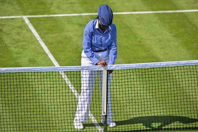 RECORD DATE NOT STATED 30th June 2026; All England Lawn Tennis and Croquet Club, London, England; Wimbledon Tennis Tournament, Day Two; An official checks the height of the net between games GodfreyxPitt