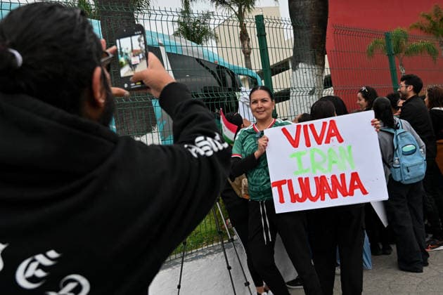Iranian national team, Nationalteam FIFA World Cup, WM, Weltmeisterschaft, Fussball 2026 leave Tijuana, Mexico camp back home to Iran TIJUANA, MEXICO - JUNE 30: A fan carries a sign that reads ‘Viva Iran Tijuana’ Long Live Iran Tijuana as she poses for a picture, as she and other fans wait for Iran s national team players to leave the Marriott Hotel at their Tijuana base camp to the airport ahead of the team’s departure following its elimination from the 2026 World Cup football tournament in Tijuana, Mexico on Tuesday, June 30, 2026. Carlos A. Moreno Anadolu Tijuana Mexico. Editorial use only. Please get in touch for any other usage.  Copyright: x2026xAnadoluxCarlosxA.xMorenox