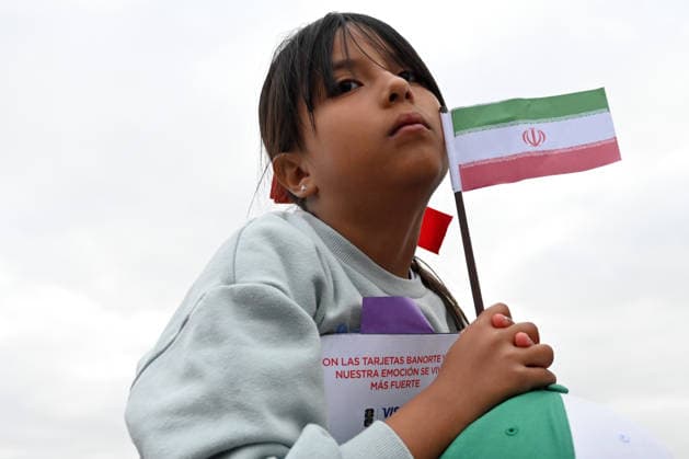 Iranian national team, Nationalteam FIFA World Cup, WM, Weltmeisterschaft, Fussball 2026 leave Tijuana, Mexico camp back home to Iran TIJUANA, MEXICO - JUNE 30: A young fan carries a flag of Iran on top of her father’s shoulders as they wait for the Iranian National Team to leave the Marriott Hotel at their Tijuana base camp to the airport ahead of the players departure following its elimination from the 2026 World Cup football tournament in Tijuana, Mexico on Tuesday, June 30, 2026. Carlos A. Moreno Anadolu Tijuana Mexico. Editorial use only. Please get in touch for any other usage.  Copyright: x2026xAnadoluxCarlosxA.xMorenox