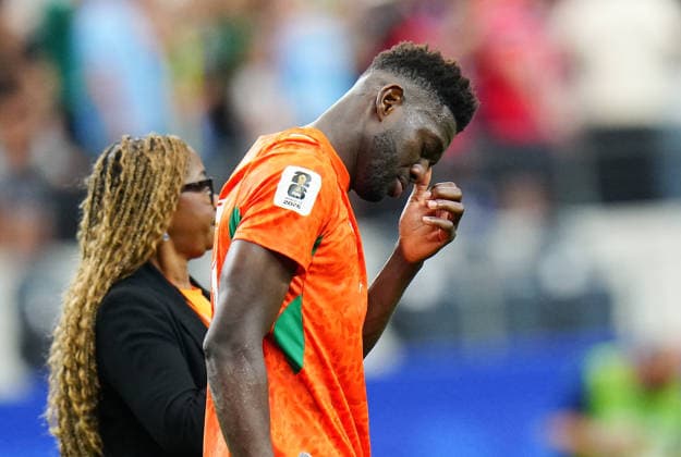 (260701) -- DALLAS, July 1, 2026 -- Ibrahim Sangare (R) of Cote d Ivoire reacts after the round of 32 match between Cote d Ivoire and Norway at the 2026 FIFA World Cup, WM, Weltmeisterschaft, Fussball at Dallas Stadium in Dallas, the United States, June 30, 2026. ) (SP)U.S.-DALLAS-FOOTBALL-FIFA WORLD CUP-ROUND OF 32-CIV VS NOR JiaxHaocheng 