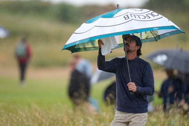 CROSBY, ENGLAND - JUNE 30: George Bryan trying to keep dry during his second round of the Final Qualifying for The Open Championship at West Lancashire Golf Club, Crosby on June 30, 2026 in Crosby, Merseyside, England The 2026 Open Championship Qualifying