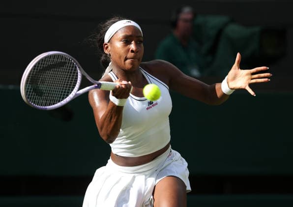 American Coco Gauff plays a forehand in her match against Argentinian Solana Sierra on day three of the 2026 Wimbledon Championships in London on Wednesday, June 01, 2026. Gauff won the match 6-3,3-6.7-6  LON2026070126 HUGOxPHILPOTT