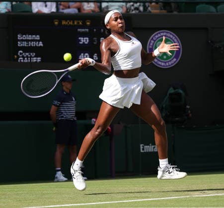 American Coco Gauff plays a forehand in her match against Argentinian Solana Sierra on day three of the 2026 Wimbledon Championships in London on Wednesday, June 01, 2026. Gauff won the match 6-3,3-6.7-6  LON2026070149 HUGOxPHILPOTT
