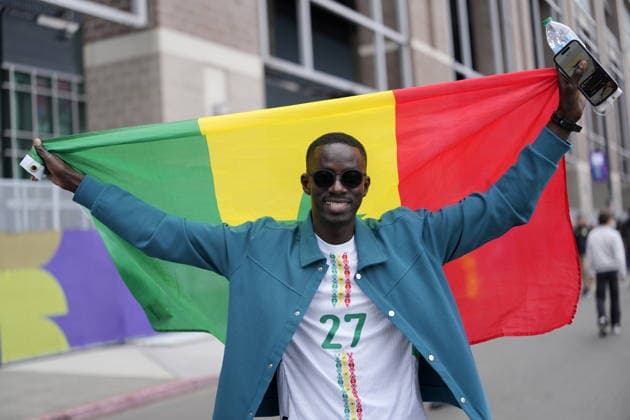 FIFA World Cup, WM, Weltmeisterschaft, Fussball 2026 - Round of 32 - Belgium vs Senegal A supporter of Senegal poses with their national flag ahead of the FIFA World Cup 2026 Round of 32 match Belgium against Senegal, in Seattle, Washington, USA, 01 July 2026. SEATTLE United States  Copyright: xSTEPHENxBRASHEARx
