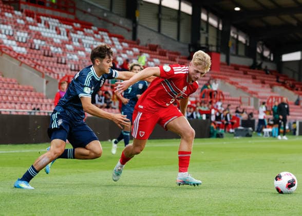 Wrexham, Wales, 1st July 2026. Rafael Pinto Pedrosa of Germany (left) and Jac Thomas of Wales (right) battle for the ball during the Wales U19 vs Germany U19 UEFA European U19 Championship match at The Racecourse, Wrexham. Picture credit should read: Cody Froggatt Sportimage EDITORIAL USE ONLY. No use with unauthorised audio, video, data, fixture lists, club league logos or live services. Online in-match use limited to 120 images, no video emulation. No use in betting, games or single club league player publications. SPI_027_CF_WALES_U19_V_GERMANY_U19 SPI-4854-0027
