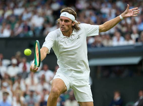2026 Wimbledon, July 01, Day 3 LONDON, - JULY 1: Stefanos Tsitsipas of Greece plays a shot against Novak Djokovic of Serbia on Centre Court during the 2026 Wimbledon, July 01, Day 3 at The all England club, Wimbledon on July 1, 2026 in London,GBR. London The all England club, Wimbledon GBR Copyright: xPeterxvanxdenxBerg ISIxPhotosx 9441