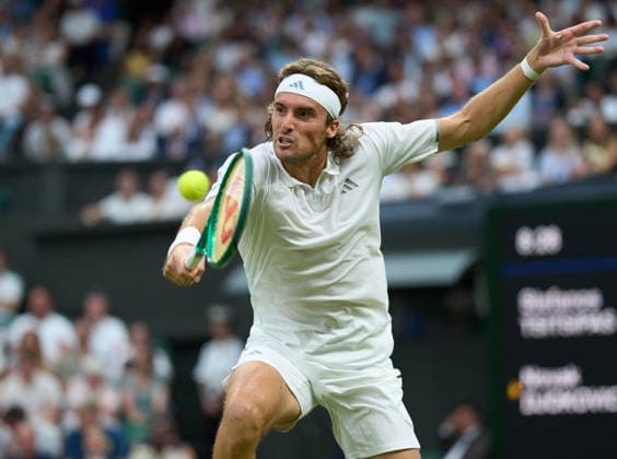 2026 Wimbledon, July 01, Day 3 LONDON, - JULY 1: Stefanos Tsitsipas of Greece plays a shot against Novak Djokovic of Serbia on Centre Court during the 2026 Wimbledon, July 01, Day 3 at The all England club, Wimbledon on July 1, 2026 in London,GBR. London The all England club, Wimbledon GBR Copyright: xPeterxvanxdenxBerg ISIxPhotosx 9441