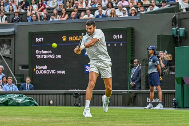 RECORD DATE NOT STATED 1st July 2026; All England Lawn Tennis and Croquet Club, London, England; Wimbledon Tennis Tournament, Day Three; Novak Djokovic (SRB) plays a backhand in his second round match against Stefanos Tsitsipas (GRE) GodfreyxPitt