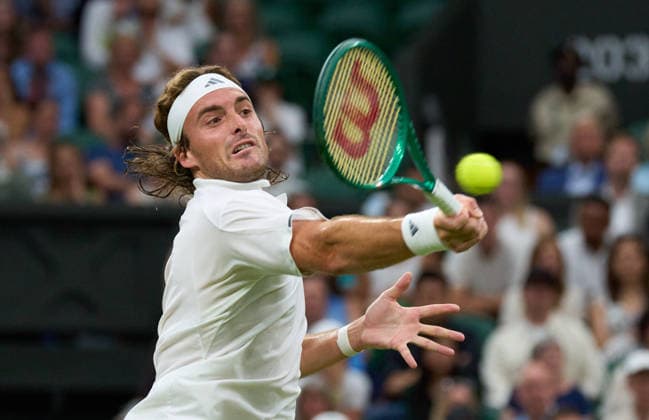 2026 Wimbledon, July 01, Day 3 LONDON, - JULY 1: Stefanos Tsitsipas of Greece plays a shot against Novak Djokovic of Serbia on Centre Court during the 2026 Wimbledon, July 01, Day 3 at The all England club, Wimbledon on July 1, 2026 in London,GBR. London The all England club, Wimbledon GBR Copyright: xPeterxvanxdenxBerg ISIxPhotosx 9441