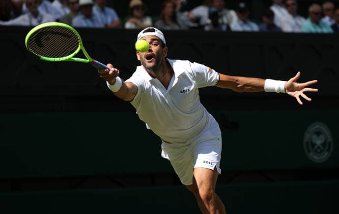 Italian Matteo Berrettini plays a forehand in his match against France s Arthur Fils at Wimbledon on day four of the 2026 Wimbledon Championships in London on Wednesday, June 02, 2026.  LON2026070242 HUGOxPHILPOTT