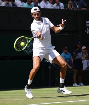 Italian Matteo Berrettini plays a forehand in his match against France s Arthur Fils at Wimbledon on day four of the 2026 Wimbledon Championships in London on Wednesday, June 02, 2026.  LON2026070250 HUGOxPHILPOTT