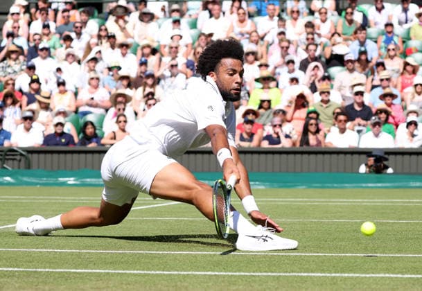 France s Arthur Fils stretches for a ball in his match against Italian Matteo Berrettini at Wimbledon on day four of the 2026 Wimbledon Championships in London on Wednesday, June 02, 2026.  LON2026070252 HUGOxPHILPOTT