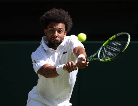 France s Arthur Fils plays a backhand in his match against Italian Matteo Berrettini at Wimbledon on day four of the 2026 Wimbledon Championships in London on Wednesday, July 2, 2026.  LON20260702241 HUGOxPHILPOTT