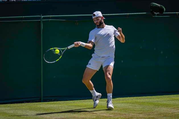 RECORD DATE NOT STATED 2nd July 2026; All England Lawn Tennis and Croquet Club, London, England; Wimbledon Tennis Tournament, Day Four; Jacob Fearnley (GBR) plays a forehand in his second round match against Jaume Munar (ESP) GodfreyxPitt