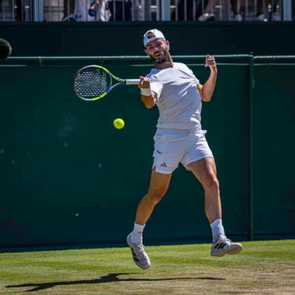 RECORD DATE NOT STATED 2nd July 2026; All England Lawn Tennis and Croquet Club, London, England; Wimbledon Tennis Tournament, Day Four; Jacob Fearnley (GBR) plays a forehand in his second round match against Jaume Munar (ESP) GodfreyxPitt