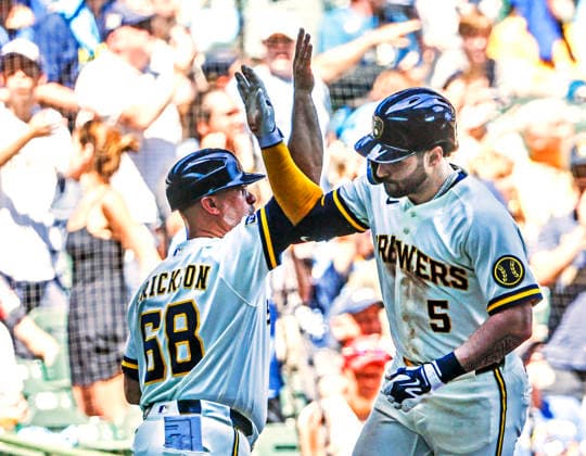 Milwaukee Brewers center fielder Garrett Mitchell (R) celebrates with Milwaukee Brewers third base coach Matt Erickson after hitting a home run in the fifth inning of the MLB, Baseball Herren, USA game between the Cincinnati Reds and the Milwaukee Brewers at American Family Field in Milwaukee, Wisconsin on Thursday, July 2, 2026.  MIL20260702819 TANNENxMAURY