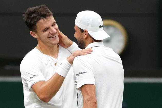 2026-07-02 The Championships - Wimbledon 2026 - Day Four LONDON, UNITED KINGDOM - JULY 2: Jakub Mensik of Czech Republic, Grigor Dimitrov of Bulgaria during Day Four of the The Championships - Wimbledon 2026 at All England Lawn Tennis and Croquet Club on July 2, 2026 in London, England. (Photo by Marleen Fouchier BSR Agency) London United Kingdom Content not available for redistribution in The Netherlands directly or indirectly through any third parties. Copyright: xBSRxAgencyx