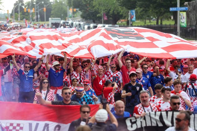 Portugal v Croatia: Round Of 32 - FIFA World Cup, WM, Weltmeisterschaft, Fussball 2026 Thousands of Croatian fans carry a large Croatian flag during a Croatian parade ahead of the FIFA World Cup 2026 Round Of 32 match between Portugal and Croatia at Toronto Stadium on July 2, 2026 in Toronto, Canada.  SanjinxStrukic PIXSELL