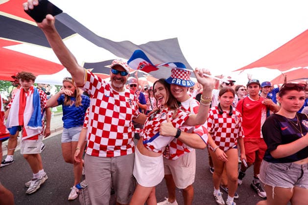 Portugal v Croatia: Round Of 32 - FIFA World Cup, WM, Weltmeisterschaft, Fussball 2026 Thousands of Croatian fans carry a large Croatian flag during a Croatian parade ahead of the FIFA World Cup 2026 Round Of 32 match between Portugal and Croatia at Toronto Stadium on July 2, 2026 in Toronto, Canada.  SanjinxStrukic PIXSELL