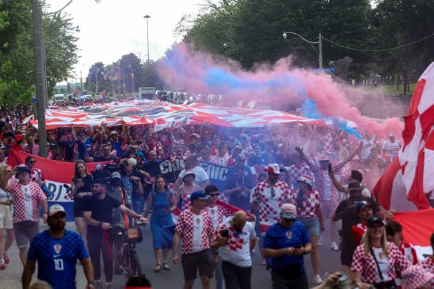Portugal v Croatia: Round Of 32 - FIFA World Cup, WM, Weltmeisterschaft, Fussball 2026 Thousands of Croatian fans carry a large Croatian flag during a Croatian parade ahead of the FIFA World Cup 2026 Round Of 32 match between Portugal and Croatia at Toronto Stadium on July 2, 2026 in Toronto, Canada.  SanjinxStrukic PIXSELL
