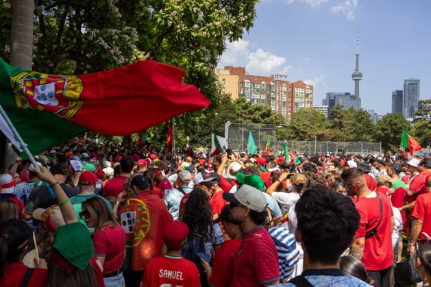 Portuguese fans in Toronto TORONTO, OT - 02.07.2026: PORTUGUESE FANS IN TORONTO - Portuguese fans take to the streets of Toronto in a festive atmosphere ahead of the match between Portugal and Croatia, wearing red and green, carrying flags and celebrating their passion for football. (Photo: R Vasconcelos Fotoarena) x2977483x  RxVasconcelos