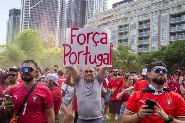 Portuguese fans in Toronto TORONTO, OT - 02.07.2026: PORTUGUESE FANS IN TORONTO - Portuguese fans take to the streets of Toronto in a festive atmosphere ahead of the match between Portugal and Croatia, wearing red and green, carrying flags and celebrating their passion for football. (Photo: R Vasconcelos Fotoarena) x2977492x  RxVasconcelos