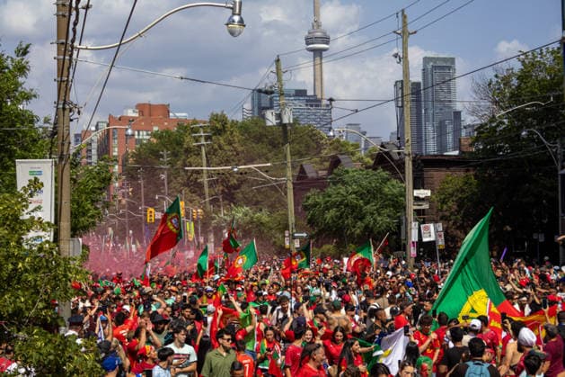 Portuguese fans in Toronto TORONTO, OT - 02.07.2026: PORTUGUESE FANS IN TORONTO - Portuguese fans take to the streets of Toronto in a festive atmosphere ahead of the match between Portugal and Croatia, wearing red and green, carrying flags and celebrating their passion for football. (Photo: R Vasconcelos Fotoarena) x2977503x  RxVasconcelos