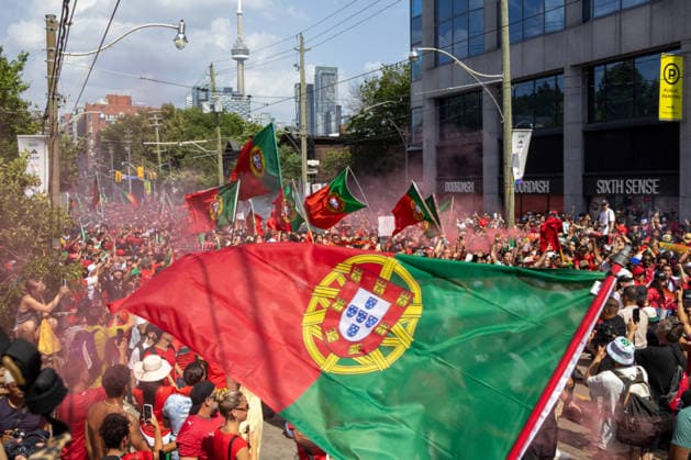 Portuguese fans in Toronto TORONTO, OT - 02.07.2026: PORTUGUESE FANS IN TORONTO - Portuguese fans take to the streets of Toronto in a festive atmosphere ahead of the match between Portugal and Croatia, wearing red and green, carrying flags and celebrating their passion for football. (Photo: R Vasconcelos Fotoarena) x2977505x  RxVasconcelos