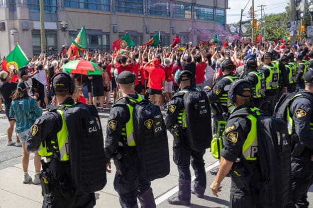 Portuguese fans in Toronto TORONTO, OT - 02.07.2026: PORTUGUESE FANS IN TORONTO - Portuguese fans take to the streets of Toronto in a festive atmosphere ahead of the match between Portugal and Croatia, wearing red and green, carrying flags and celebrating their passion for football. (Photo: R Vasconcelos Fotoarena) x2977517x  RxVasconcelos