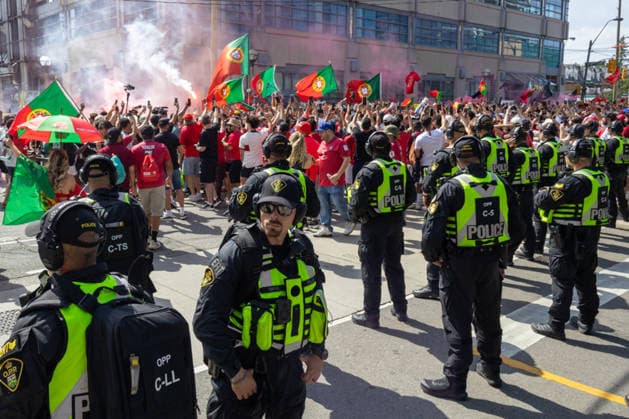 Portuguese fans in Toronto TORONTO, OT - 02.07.2026: PORTUGUESE FANS IN TORONTO - Portuguese fans take to the streets of Toronto in a festive atmosphere ahead of the match between Portugal and Croatia, wearing red and green, carrying flags and celebrating their passion for football. (Photo: R Vasconcelos Fotoarena) x2977518x  RxVasconcelos