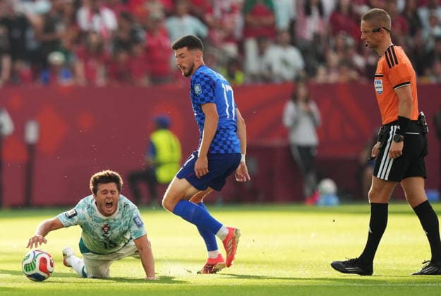 July 2, 2026, Toronto, On, CANADA: Portugal s Joao Neves (left) is taken down by Croatia s Petar Sucic (17) during the first half of a World Cup round of 32 soccer match, in Toronto on Thursday, July 2, 2026. Canada News - July 2, 2026  - ZUMAc35_ 20260702_zaf_c35_098 Copyright: xNathanxDenettex