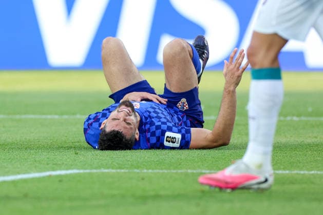 Portugal v Croatia: Round Of 32 - FIFA World Cup, WM, Weltmeisterschaft, Fussball 2026 Mateo Kovacic of Croatia lies on the pitch during the FIFA World Cup 2026 Round Of 32 match between Portugal and Croatia at Toronto Stadium on July 2, 2026 in Toronto, Canada.  SanjinxStrukic PIXSELL